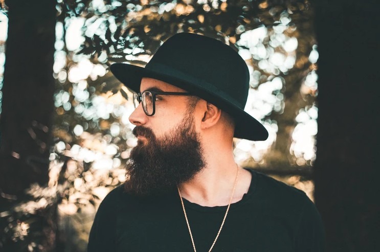 man wearing a black bowler hat