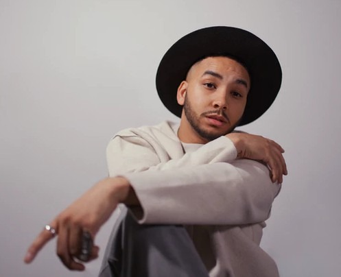 man wearing a black trilby