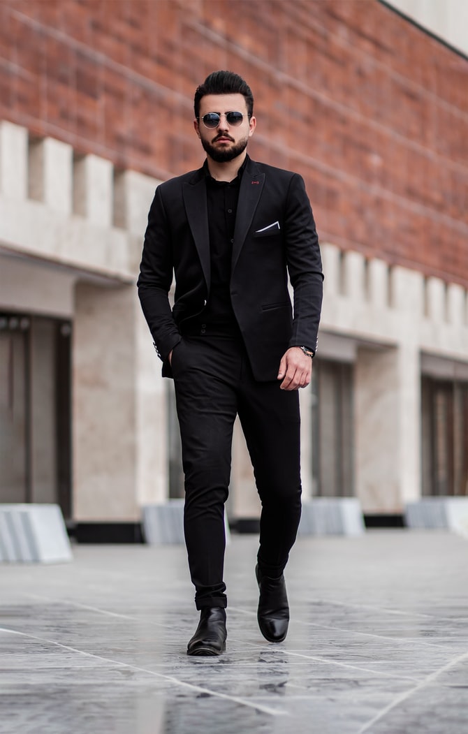 What do you think of businessmen who wear all black suits? Is there a look  they are going for? - Quora