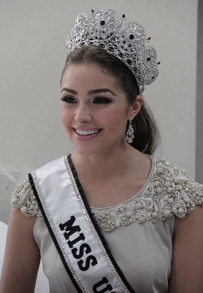 Olivia Culpo wearing her Miss Universe crown and sash