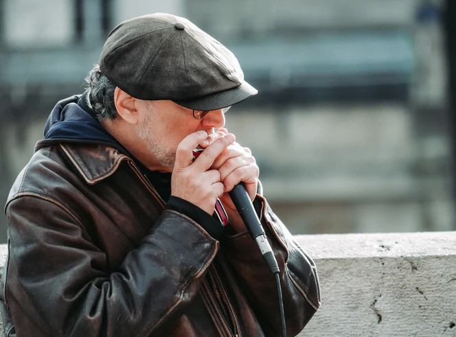 man wearing a black flat cap