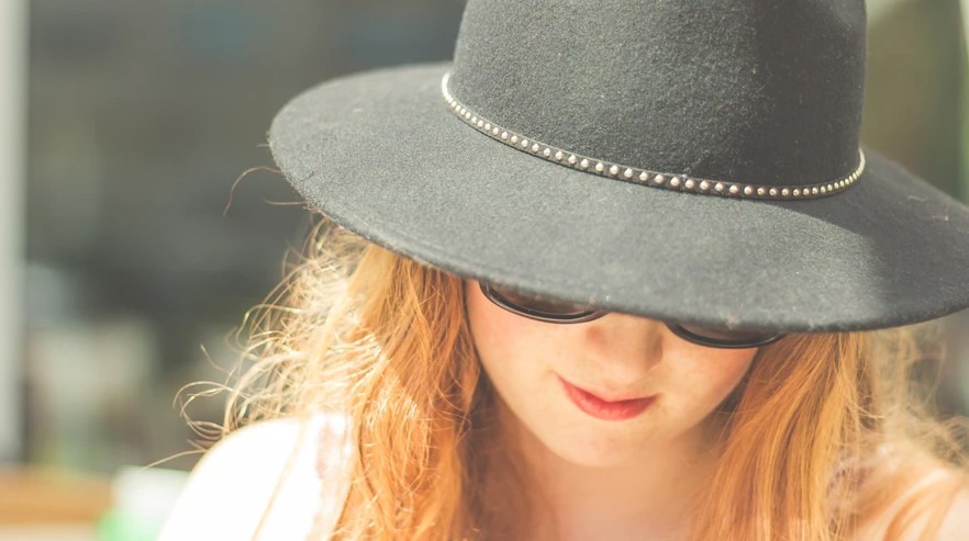 woman wearing a felt hat