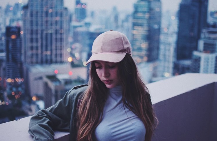 woman wearing a pink baseball cap