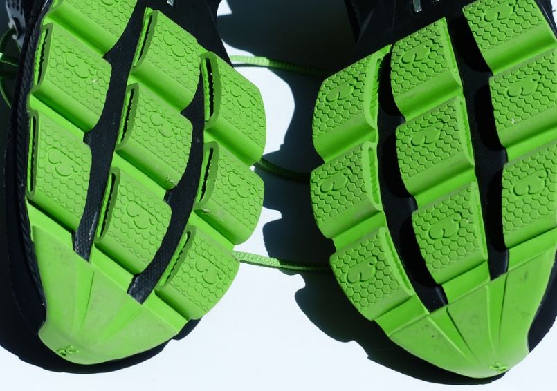 A pair of green rubber soles