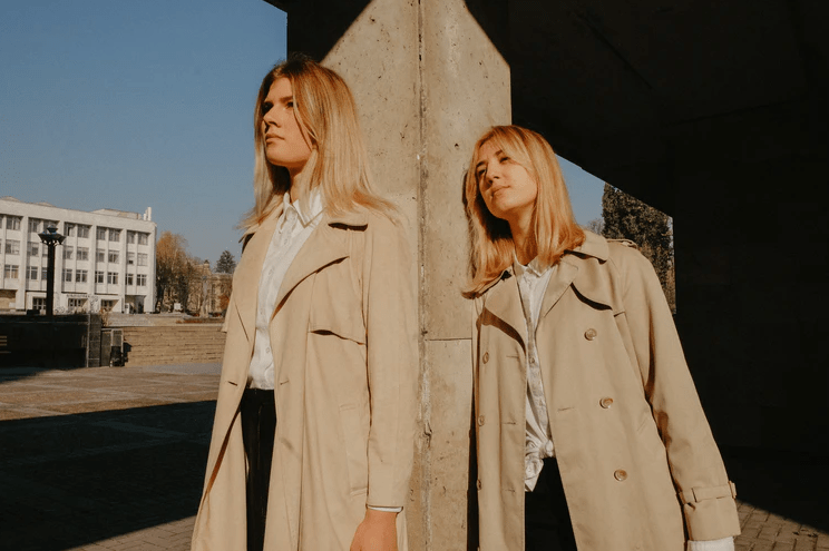 women wearing trench coats