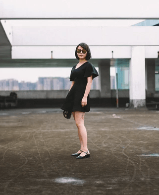 woman wearing a little black dress